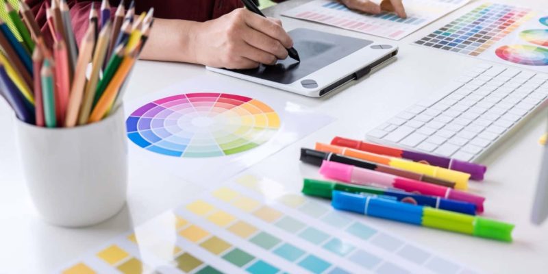 image of person designing branding with color