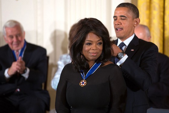 image of oprah winfrey receiving medal from barack obama